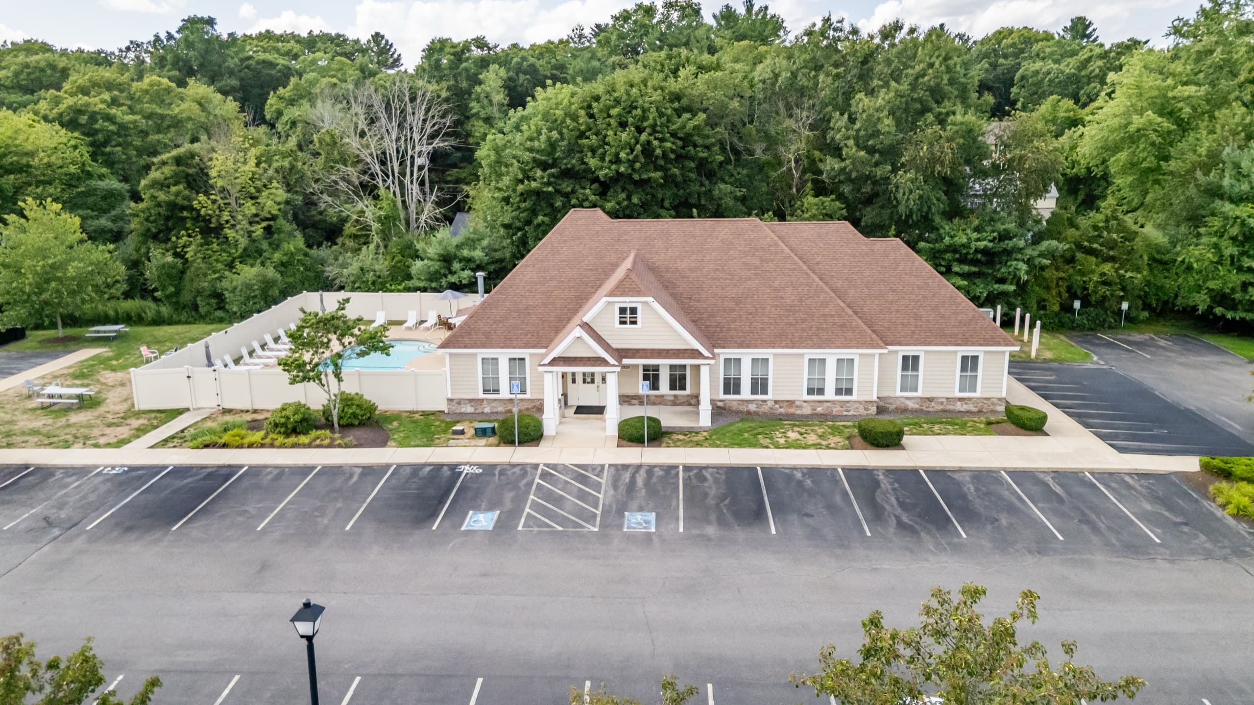 The Edgewood Apartments clubhouse and pool area from above.